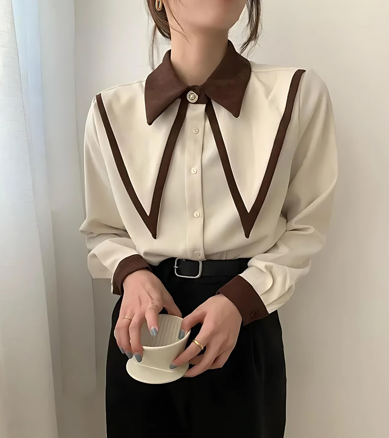 A cream-colored shirt with deep brown detailing on the collar and cuffs, embodying the Light Academia aesthetic.